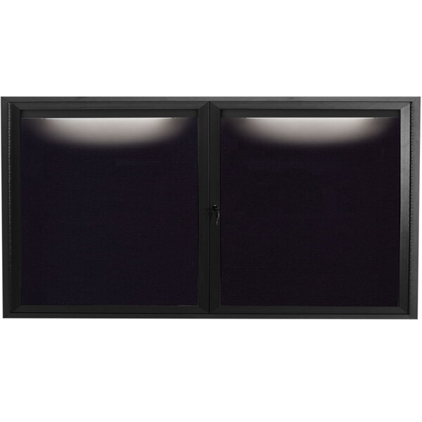 A black rectangular window with two black panels and a light on it.