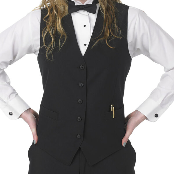 A woman wearing a black Henry Segal server vest and bow tie.