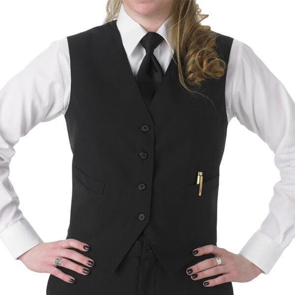 A woman in a black Henry Segal server vest and tie.