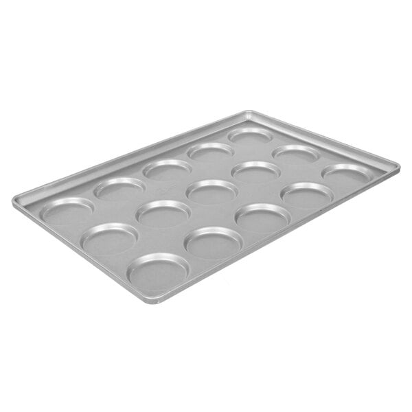 A Chicago Metallic bread pan with 15 molds for hamburger buns, muffin tops, and cookies.
