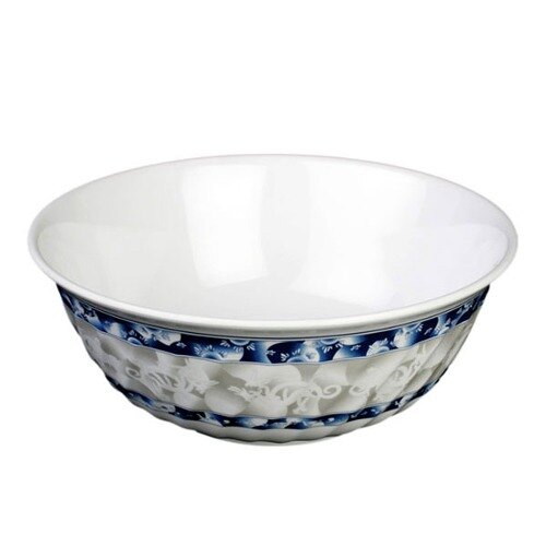 A white melamine bowl with blue dragon designs on the outside.