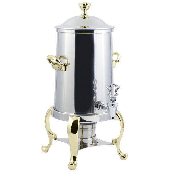 A silver stainless steel Bon Chef coffee chafer urn with brass trim.