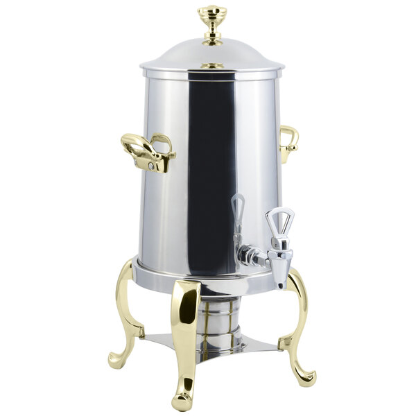 A stainless steel Bon Chef coffee chafer urn with brass trim.