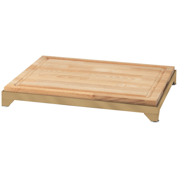 An Eastern Tabletop butcher block carving board with a bronze coated stainless steel frame.