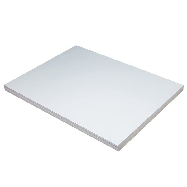 A stack of white rectangular Pacon tagboard sheets.
