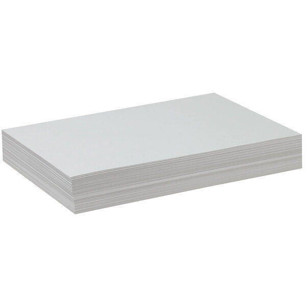 A stack of white Pacon drawing paper on a white background.