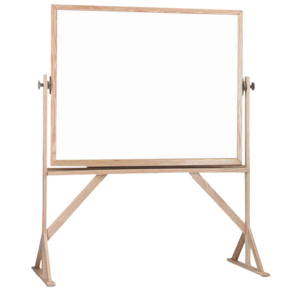 A Aarco white melamine markerboard on a wooden stand with a wooden frame.