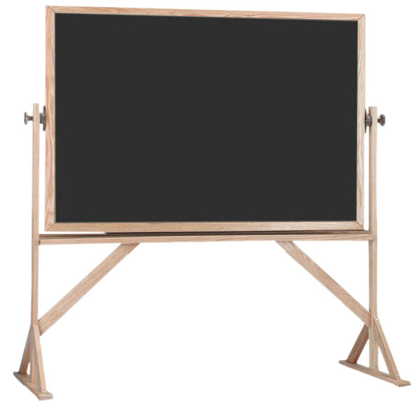 A blackboard with a solid oak wood frame and wooden stands.