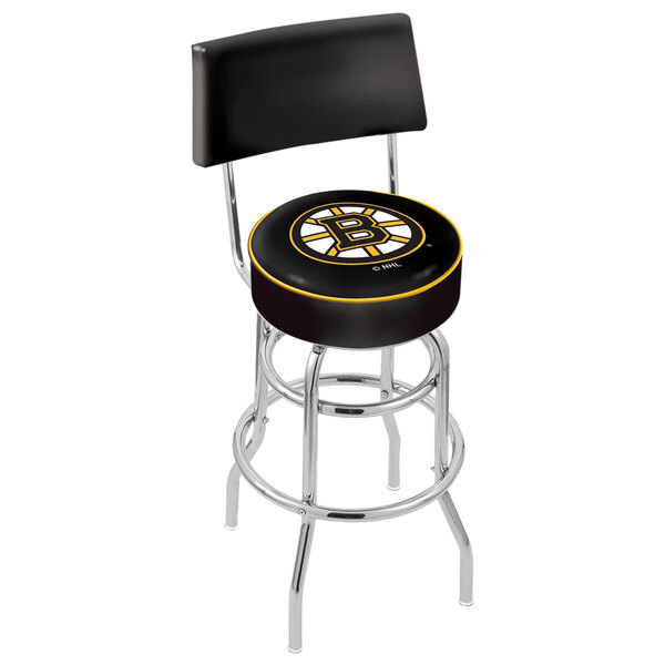 A black and yellow bar stool with a Boston Bruins hockey puck cushion on the seat and a hockey puck design on the backrest.