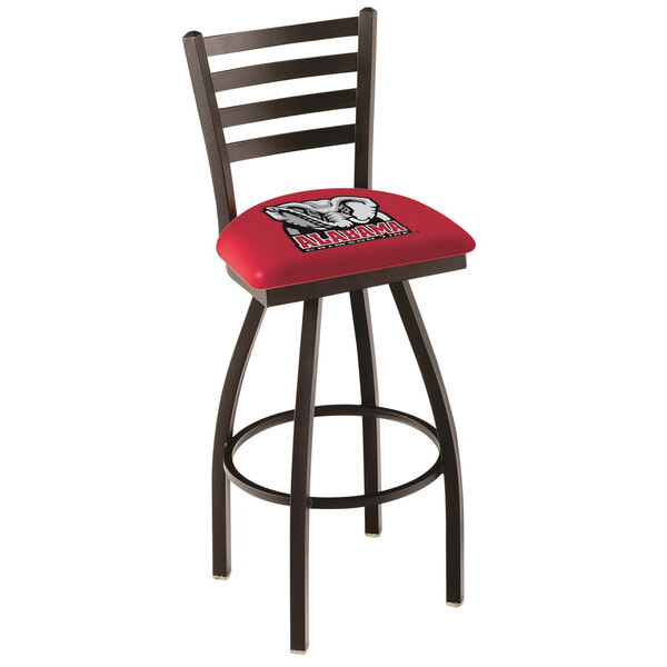 A red University of Alabama swivel bar stool with a logo on the cushion and ladder back.