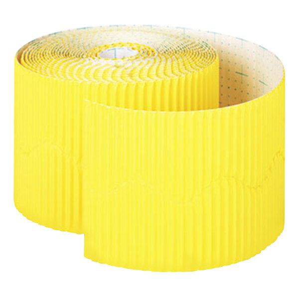 A roll of yellow paper with a decorative edge.