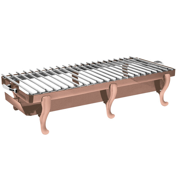 An Eastern Tabletop copper coated stainless steel grill stand with removable grill top on a metal table.