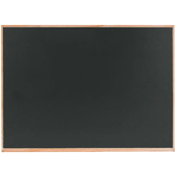 A slate gray chalkboard with a solid oak wood frame.