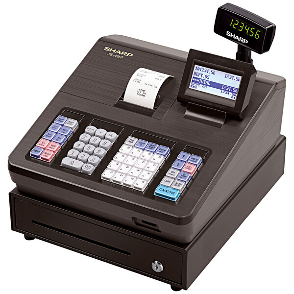 A Sharp XEA207 electronic cash register with a digital display on a counter.