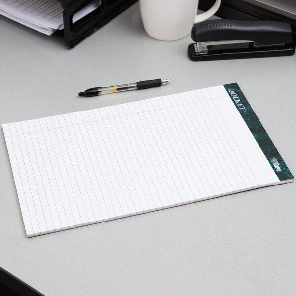 A TOPS Docket notepad and pen on a desk.