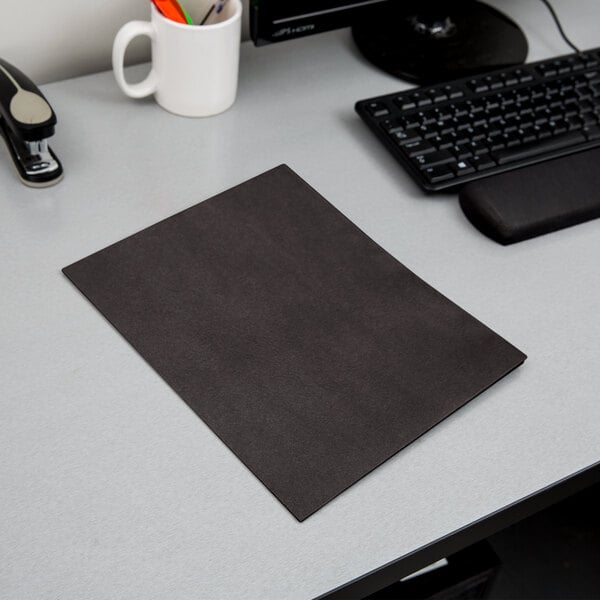 A black Oxford 2-pocket paper folder on a white surface.