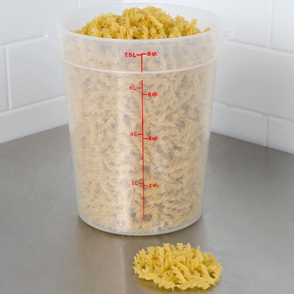 A Cambro translucent plastic container filled with pasta.
