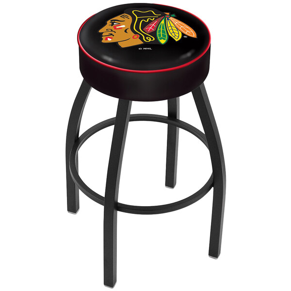 A black bar stool with a red padded seat and a Chicago Blackhawks hockey team logo on the seat cover.