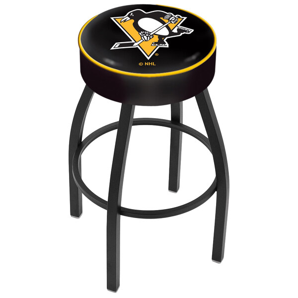 A black swivel bar stool with a yellow Pittsburgh Penguins logo on the seat.