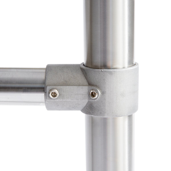 An aluminum Regency joint socket with two screws on a metal pipe.