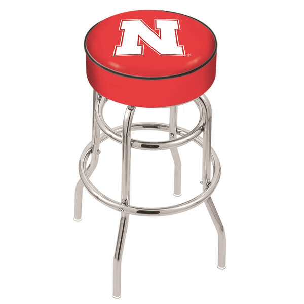 A red Holland Bar Stool with a University of Nebraska logo on the seat and back.