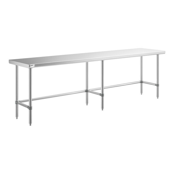 A long, rectangular metal table with six legs and a flat surface, supported by horizontal bars connecting the legs.