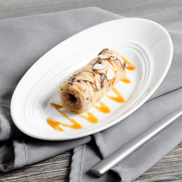 A white Bon Chef porcelain plate with a dessert on it.