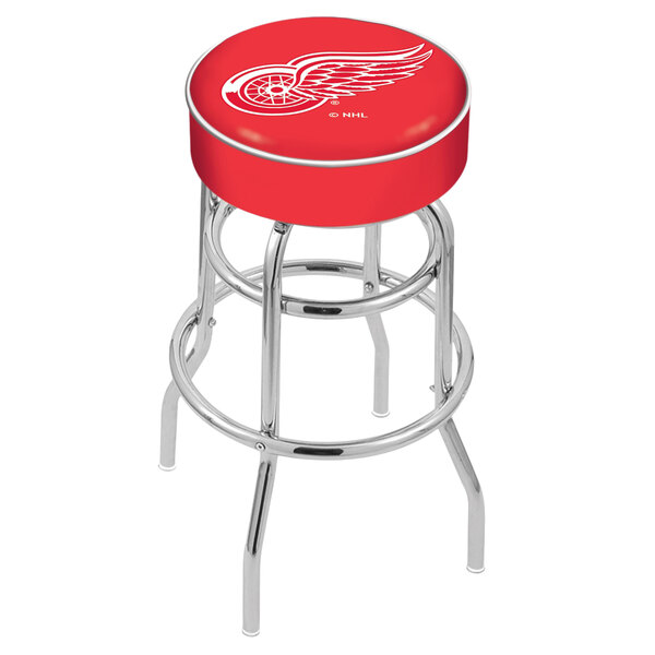 A red Holland Bar Stool swivel bar stool with the Detroit Red Wings logo on the seat.