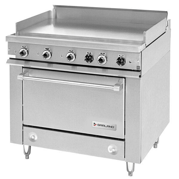 A large stainless steel Garland electric range with griddle top.