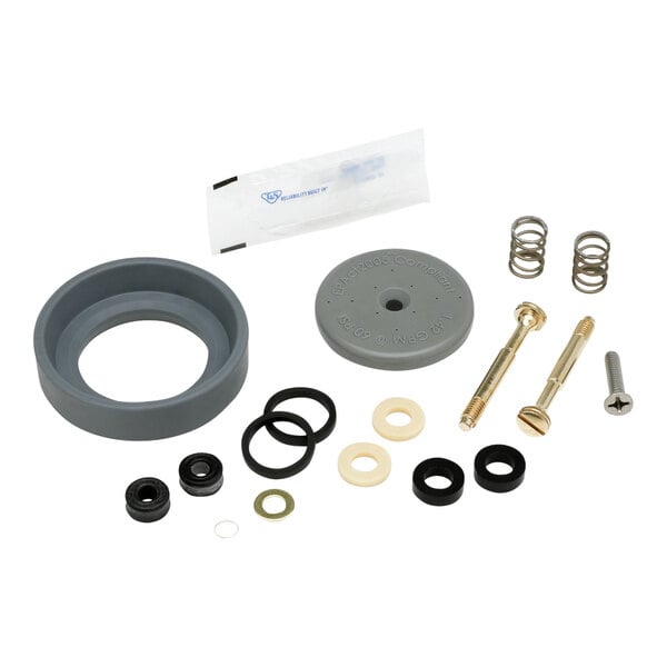 A group of T&S pre-rinse spray valve parts including a grey rubber ring with a hole in it.