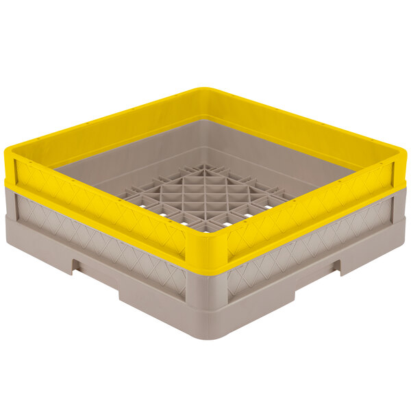 A Vollrath Traex beige plastic rack with yellow and grey plastic sides.
