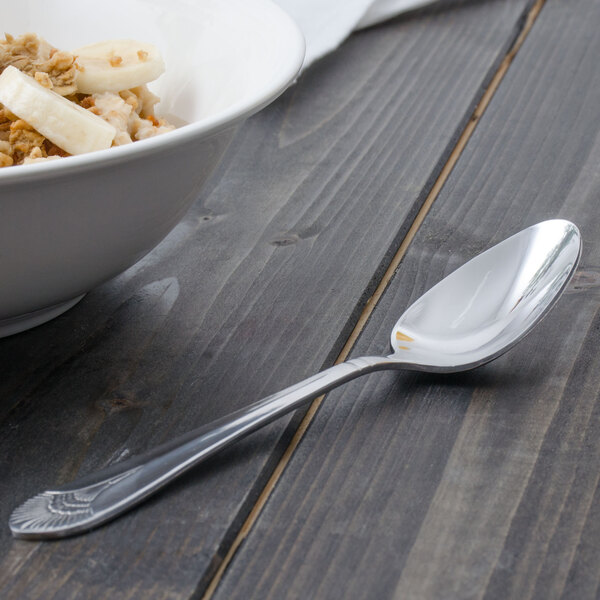 A bowl of cereal with a Walco Meteor stainless steel spoon.