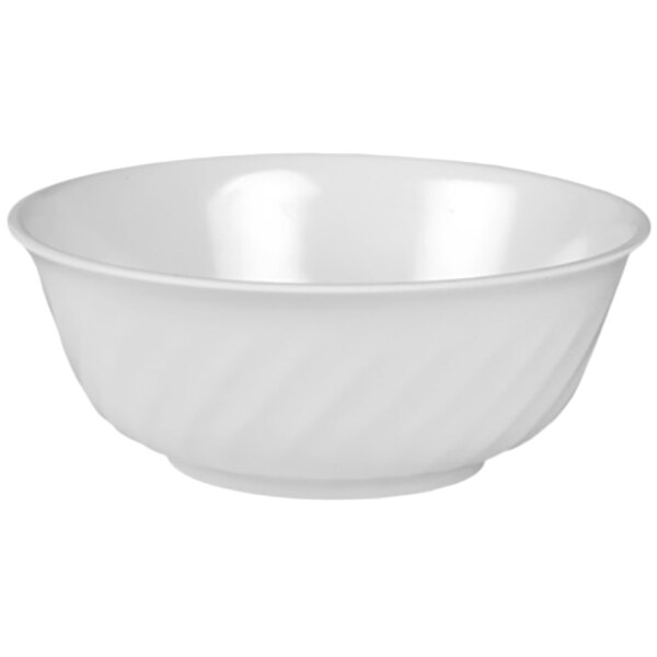 A white melamine bowl with a wavy design on the edge.