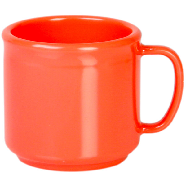 An orange mug with a handle.