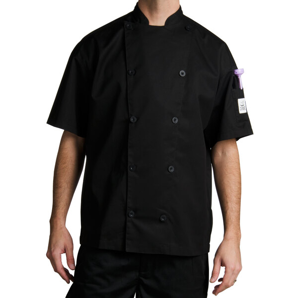 A man wearing a black Chef Revival long sleeve chef coat.