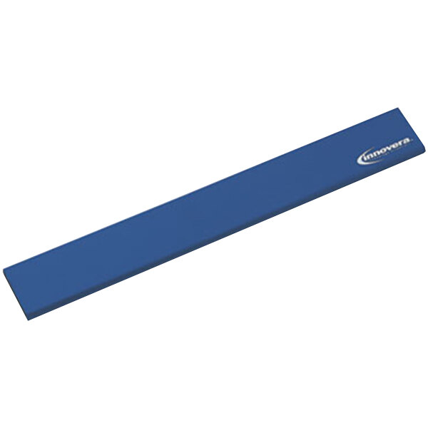 A blue rectangular rubber wrist rest with white text.