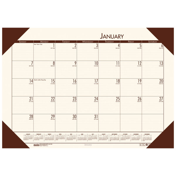 A House of Doolittle desk pad calendar with a white background and brown corner design.
