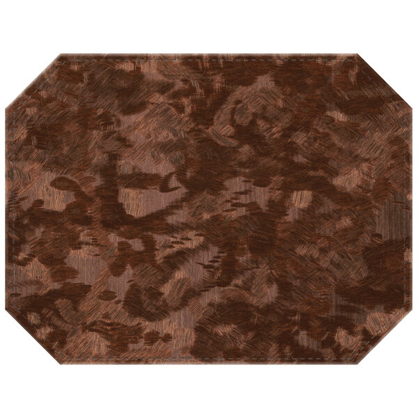 A bronze rectangular placemat on a brown surface.