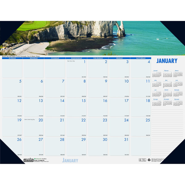 A House of Doolittle desk pad calendar with a photo of cliffs and a beach.
