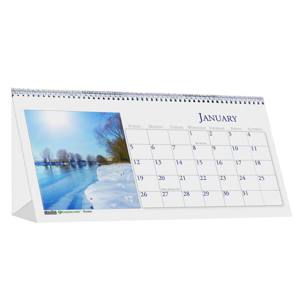 A House of Doolittle desk tent calendar page with a picture of a river and snow-covered ground.