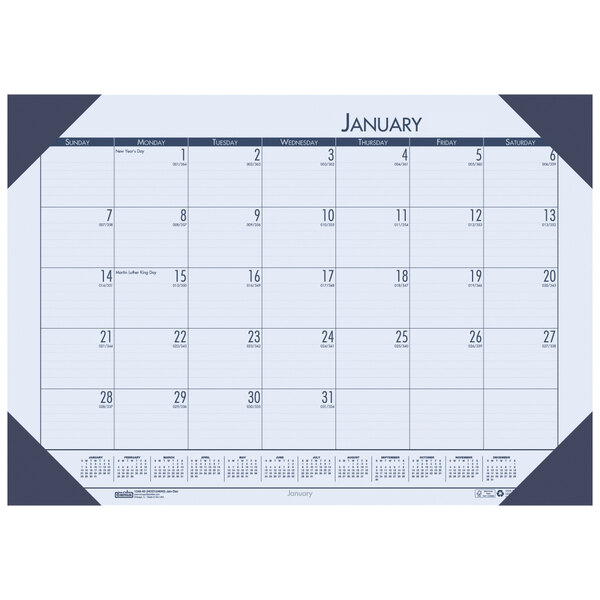 A House of Doolittle desk pad calendar with black numbers, days of the week, and a blue border.