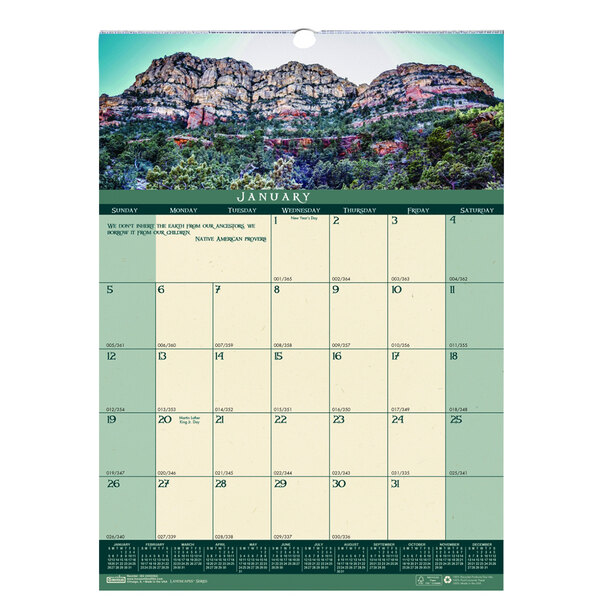A House of Doolittle wall calendar with a rocky mountain and blue sky in the background.