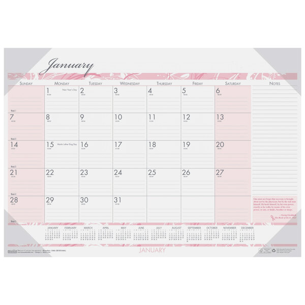 A House of Doolittle desk pad calendar with pink and white Breast Cancer Awareness design and numbers for dates and days of the week.