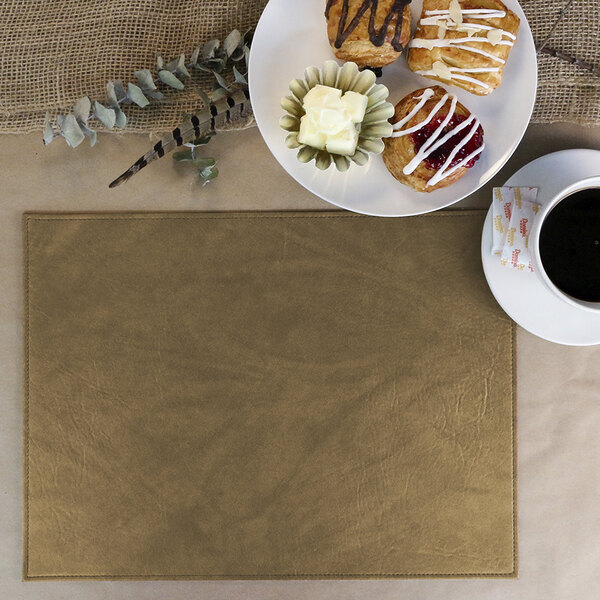 A Harley faux leather rectangle placemat on a table with a plate of pastries and a cup of coffee.
