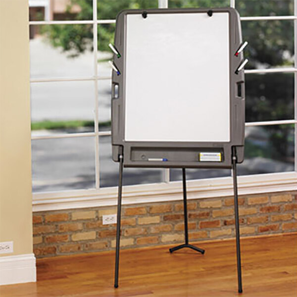 A charcoal Iceberg portable flipchart easel with dry erase surface on a black stand.