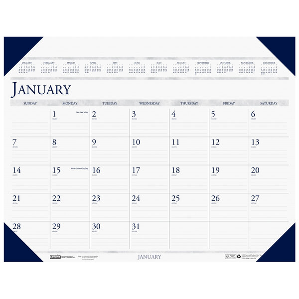 A white desk pad calendar with blue and white numbers and a blue border.