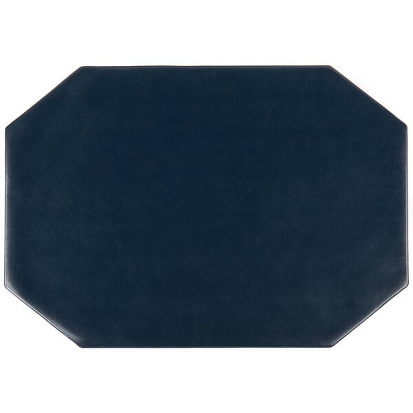 A blue octagon shaped placemat on a table.