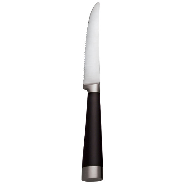 A Libbey stainless steel serrated steak knife with a black handle and white blade.