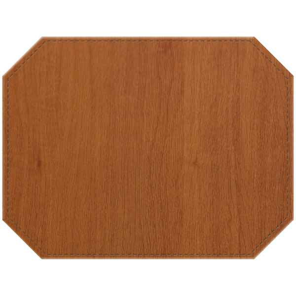 A Sherwood maple premium sewn faux wood octagon placemat on a wood table.