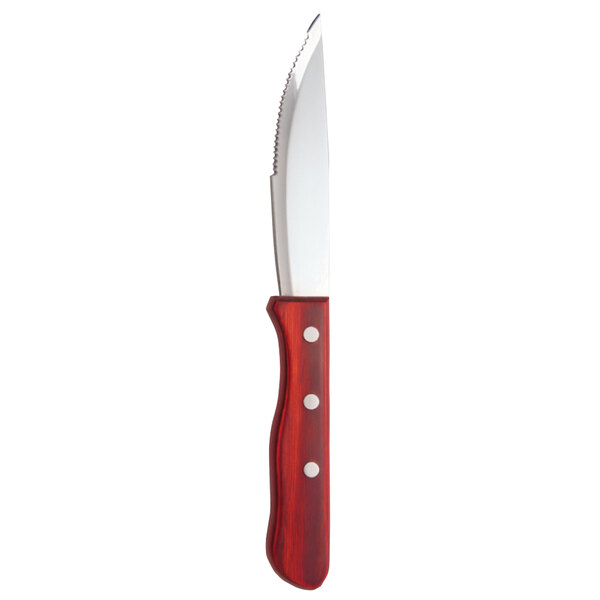 A Libbey stainless steel steak knife with a red pakkawood handle.